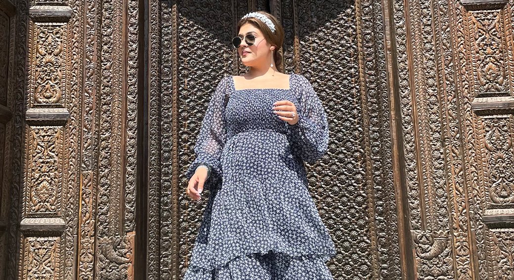 women in blue tiered maxi dress