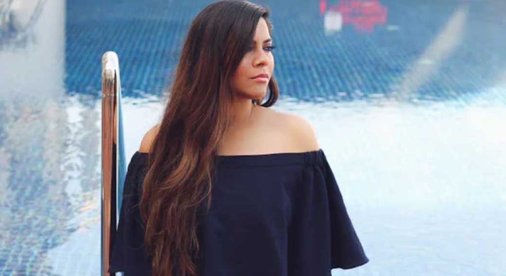 model-wearing-off-shoulder-jumpsuit